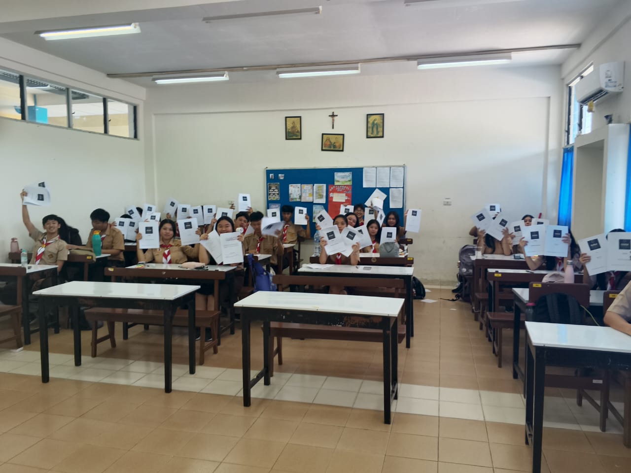 Students holding GSDLA debate materials
